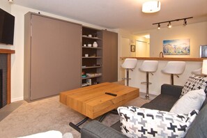Showing the living area (note the MURPHY bed wall pull down with Queen bed)