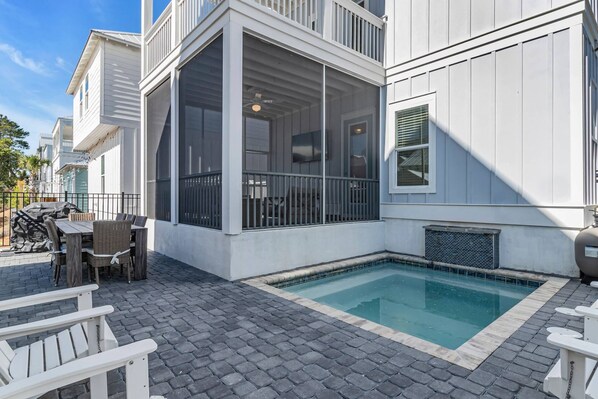 Fenced backyard with private pool, screened lanai, and outdoor dining space!