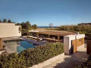 Blending into the coastal landscape of Tsilivi.