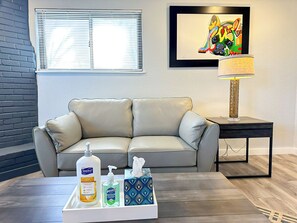 Enjoy tranquil mornings or lively evenings in a spacious living room filled with natural light