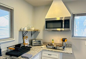 A bright kitchen and dining area create a welcoming space for meals and conversation