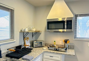 A bright kitchen and dining area create a welcoming space for meals and conversation