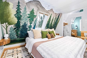 Stunning hand painted mural and heated luxury king mattress in your loft master bedroom retreat.