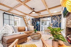 Beautiful cozy living space with comfy sofa and radiant heated fireplace.