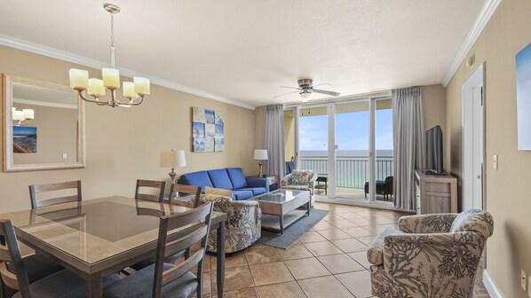 The living room offers ample, comfortable seating, a large flat screen television, and incredible views of the Gulf of Mexico.