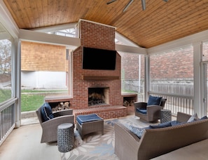 Come together and enjoy the ambiance of the outdoor fireplace and TV