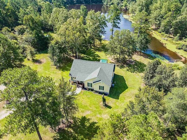 House by the lake from above