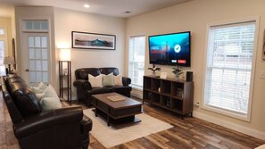 Specious Livingroom with 65" flat screen smart Roku TV