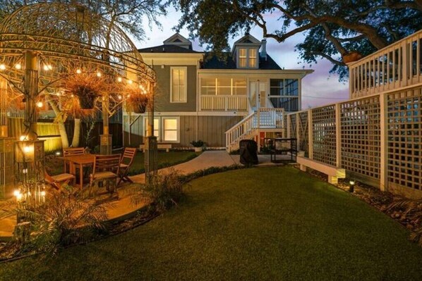 The gazebo looks magical at night time, lighting up the entire backyard!