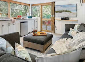 There's an outdoor screened dining area with its own kitchenette and TV lounge.