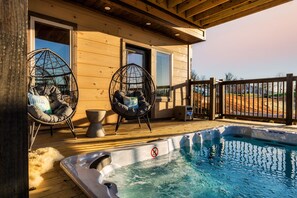 Swim Spa with a nearby projector for outdoor movies in the pool.
