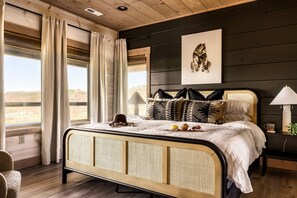 Secondary king bedroom on the upper level. Ensuite bathroom with shower and tub.
