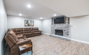 View of Electric fireplace and 50' Smart HDTV with Roku streaming.  Lots of open space.