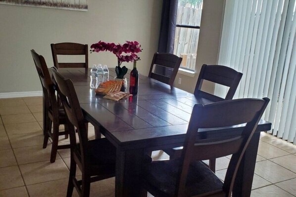 The dining table provides a cozy and functional space where guests can enjoy delicious meals and moments of togetherness during their stay.