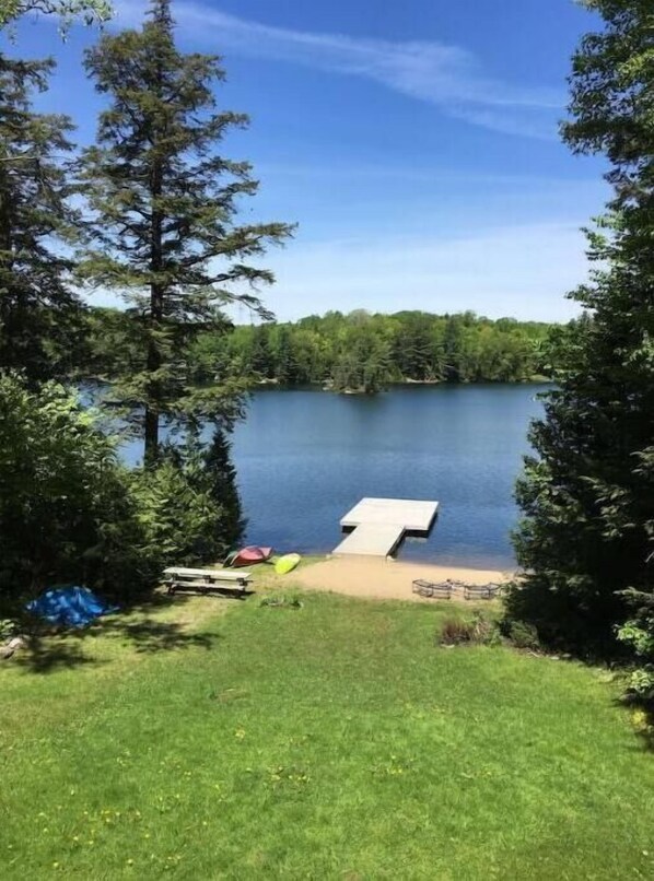 View from the deck, of the beach, main dock, and small islands to swim to.