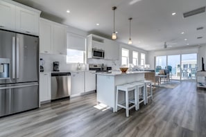 The spacious open-concept kitchen provides a generous and inviting environment for you and your family to enjoy shared culinary experiences.
