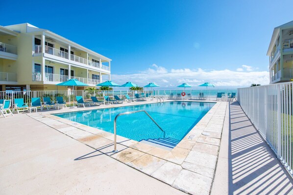 The top-left unit at Salt Life offers stunning ocean views from its elevated position, just steps away from the shared pool for ultimate relaxation.