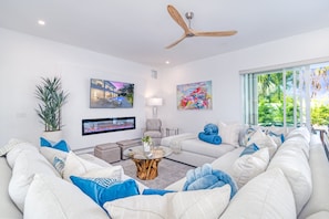 Living Room with plenty of seating and flat screen television.