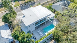 Aerial View of home with the pool and patio the focus.