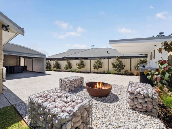 Gather Around the Fire Pit – The perfect spot to unwind under the stars with family and friends.