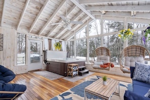 Grander view of the porch with hot tub.