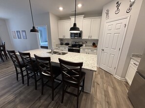 Well-appointed kitchen with countertop seating