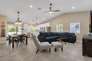 Great open floor plan with living, dining area and kitchen that over looks the backyard