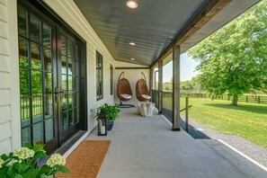 Serene and scenic front porch, facing the pond.