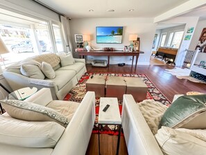 Large living room with big screen TV
