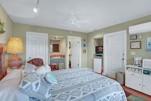 Alternate room showing the bathroom entrance and television.