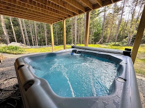 After a day of exploring, return to the cozy cabin and relax in the outdoor hot tub, surrounded by nature.