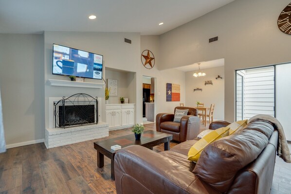Alternate view of the fireplace, family gathering room, dining area.
