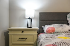 This nightstand is the ideal spot to store personal items and charge a phone.