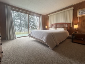 Master bedroom with a queen bed and lake views!