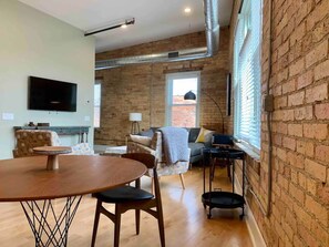 Open dining and living room area overlooks City Center Park.