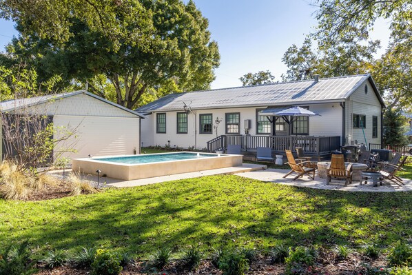 The Cottage has shared access to the backyard pool and fire pit!
