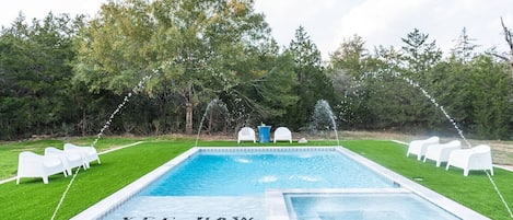 Outdoor pool area and hot tub