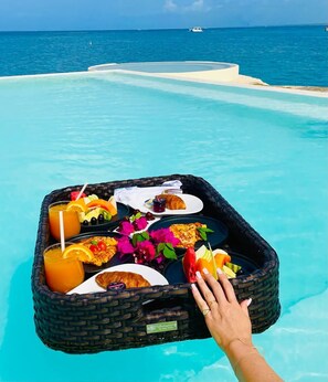 Essentially, it's a tray of food and beverages served floating in a pool