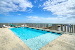 Waterfront community pool with panoramic views.