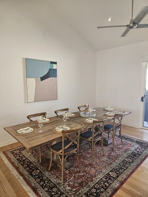 Seats 10 people comfortably. Oak table with farmhouse cross back chairs.