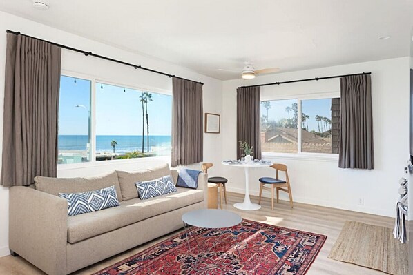 Living room, 180 degree panoramic ocean view from window and front patio.