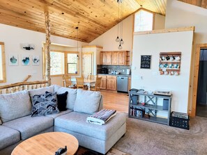 Second-floor living room into the huge kitchen.