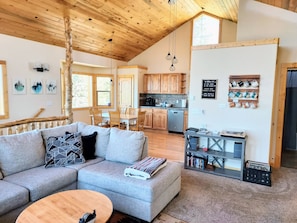 Second-floor living room into the huge kitchen.