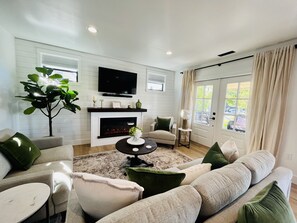 French doors off of the living room leading out to a large covered porch