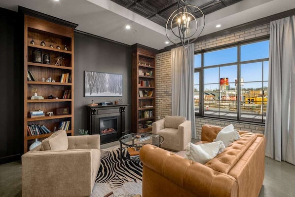 Living Room: Plush leather couch and two accent chairs provide ample space to lounge and watch your favorite show.