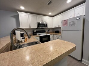 Kitchen with all Amenities to Enjoy Cooking from Your Home Away from Home