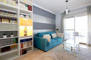 Bright lounge area with comfortable seating and access to the terrace