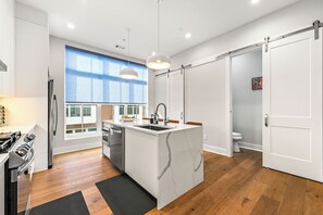 Beautifully designed kitchen with all stainless steel appliances and amenities including: 

Rice cooker, air fryer, Blender, Instance Coffee Maker, Coffee grinder, Whisker, measuring cups, baking pan set, complete set of pots and pans, dishes, silverware, oven, and more