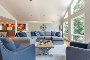 Living room with large windows and beautiful views of Lake Hartwell.