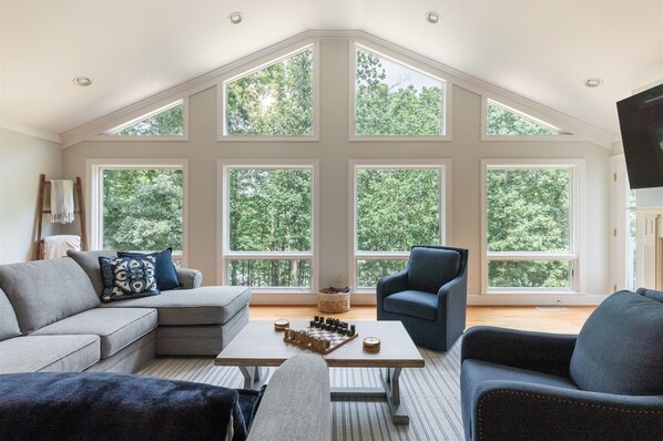 Living room with large windows and beautiful views of Lake Hartwell.